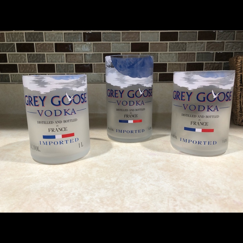 Two Grey Goose rocks glasses and a pint glass.